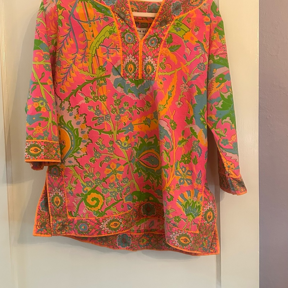 It is a jungle soirée hosted by GRETCHEN SCOTT. Vibrant Tunic